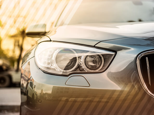 A close up of a headlight on a used BMW