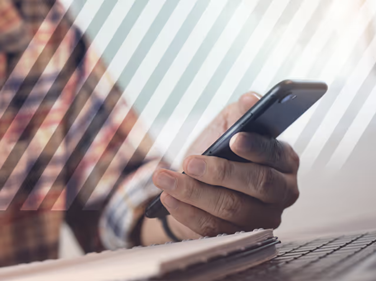 A man holding his phone to look at a website.