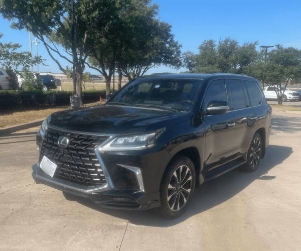 A black used 2021 Lexus LX 570 in a parking lot