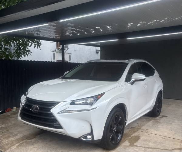 A white used 2017 Lexus NX 200t in a parking lot