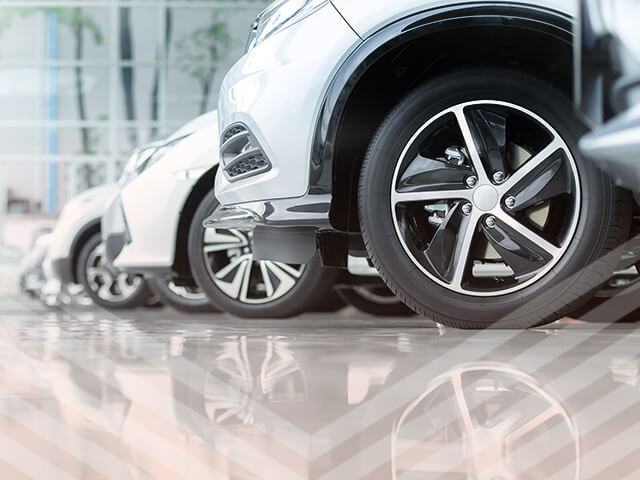 A row of cars in a dealership