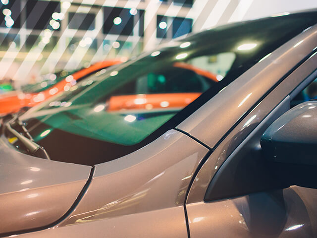A close up of a car windshield in a dealership