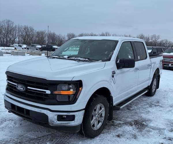 A used white 2025 Ford F-150 in a parking lot