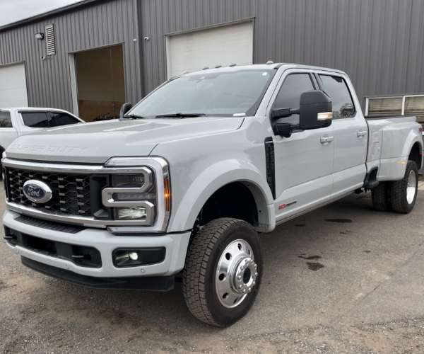 A white Ford F-450 in a parking lot