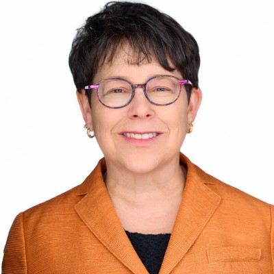 Leanne Fitzgerald, ACV's Chief Legal Officer, looks into the camera, smiles at the camera in a black sweater.
