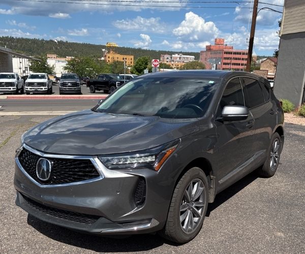 A 2023 Acura RDX in a used car parking lot