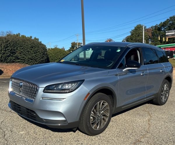 A used silver 2022 Lincoln Corsair parked in a dealer lot