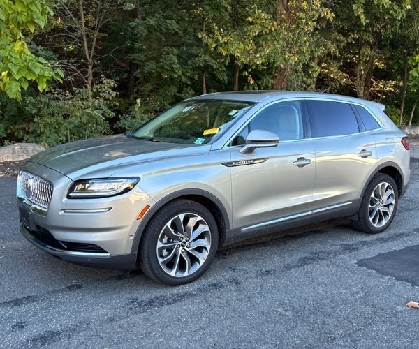 A used 2023 Lincoln Nautilus parked in an empty lot 