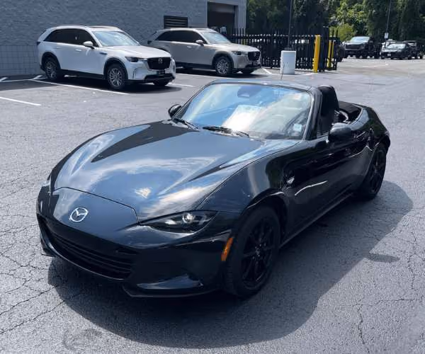 A blue Chevrolet Corvette in an empty parking lot
