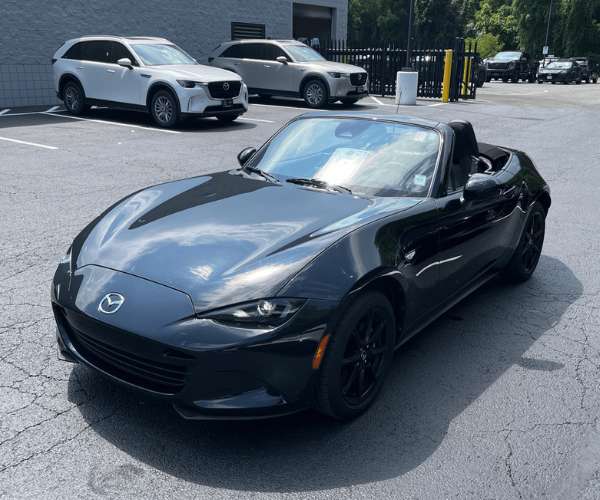 A blue Chevrolet Corvette in an empty parking lot