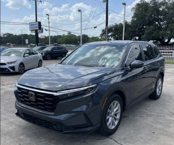 A red Mazda CX-5 in empty parking lot