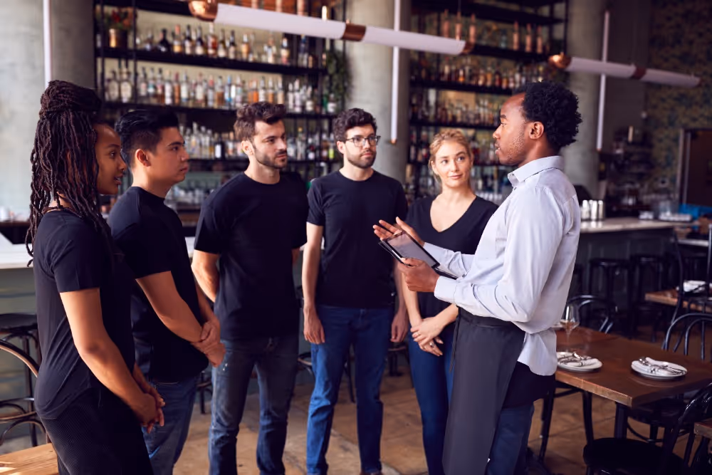 Man talking to staff