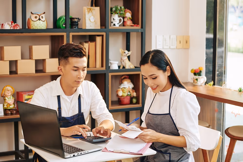 man and woman working in restaurant