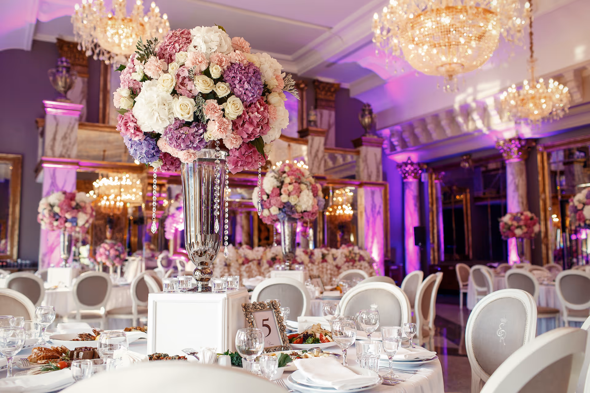 Table decorated with pink and purple hydrangeas
