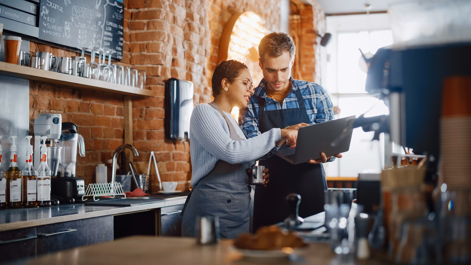 Two restaurant managers have a team meeting