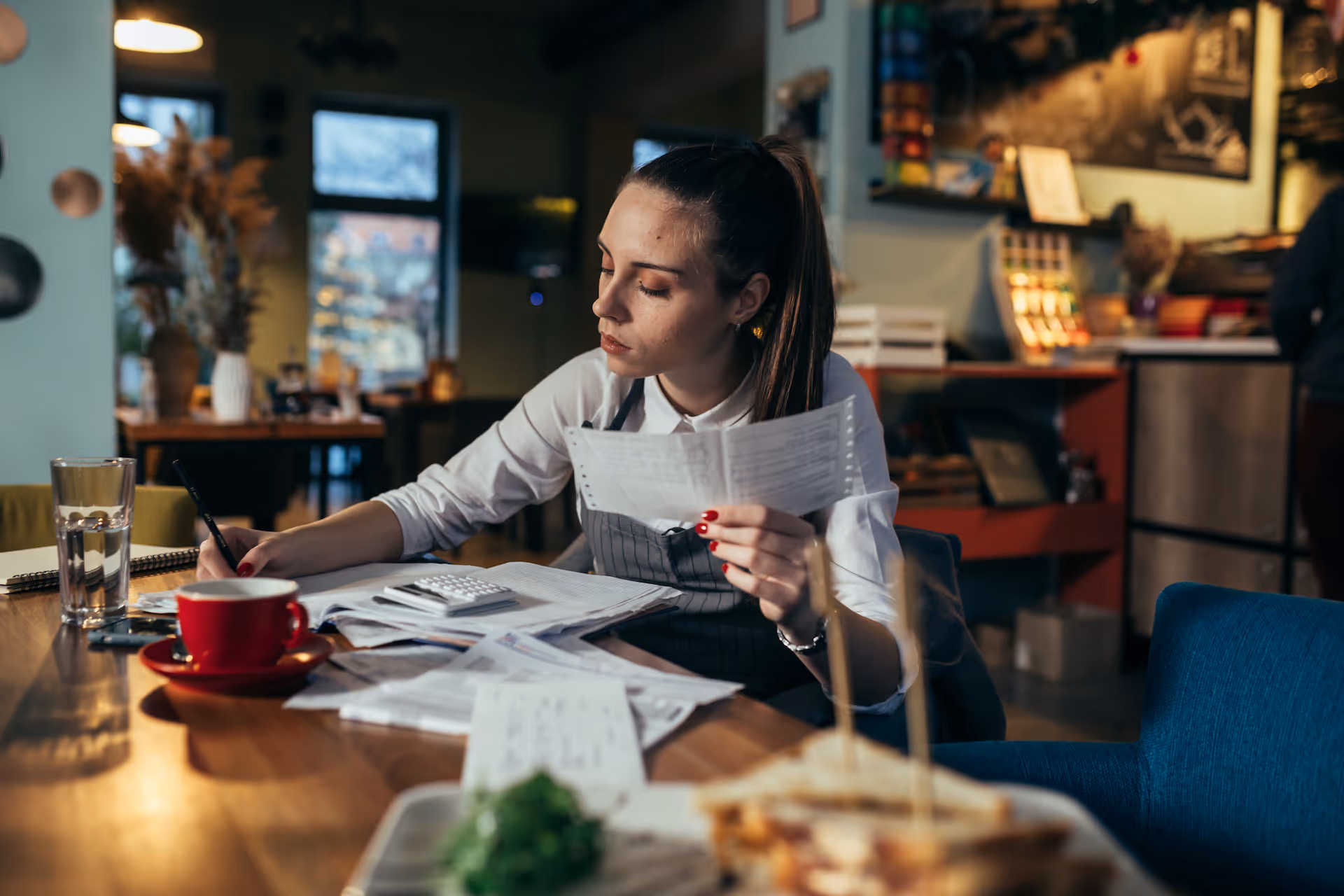 manager dealing with finances in her restaurant