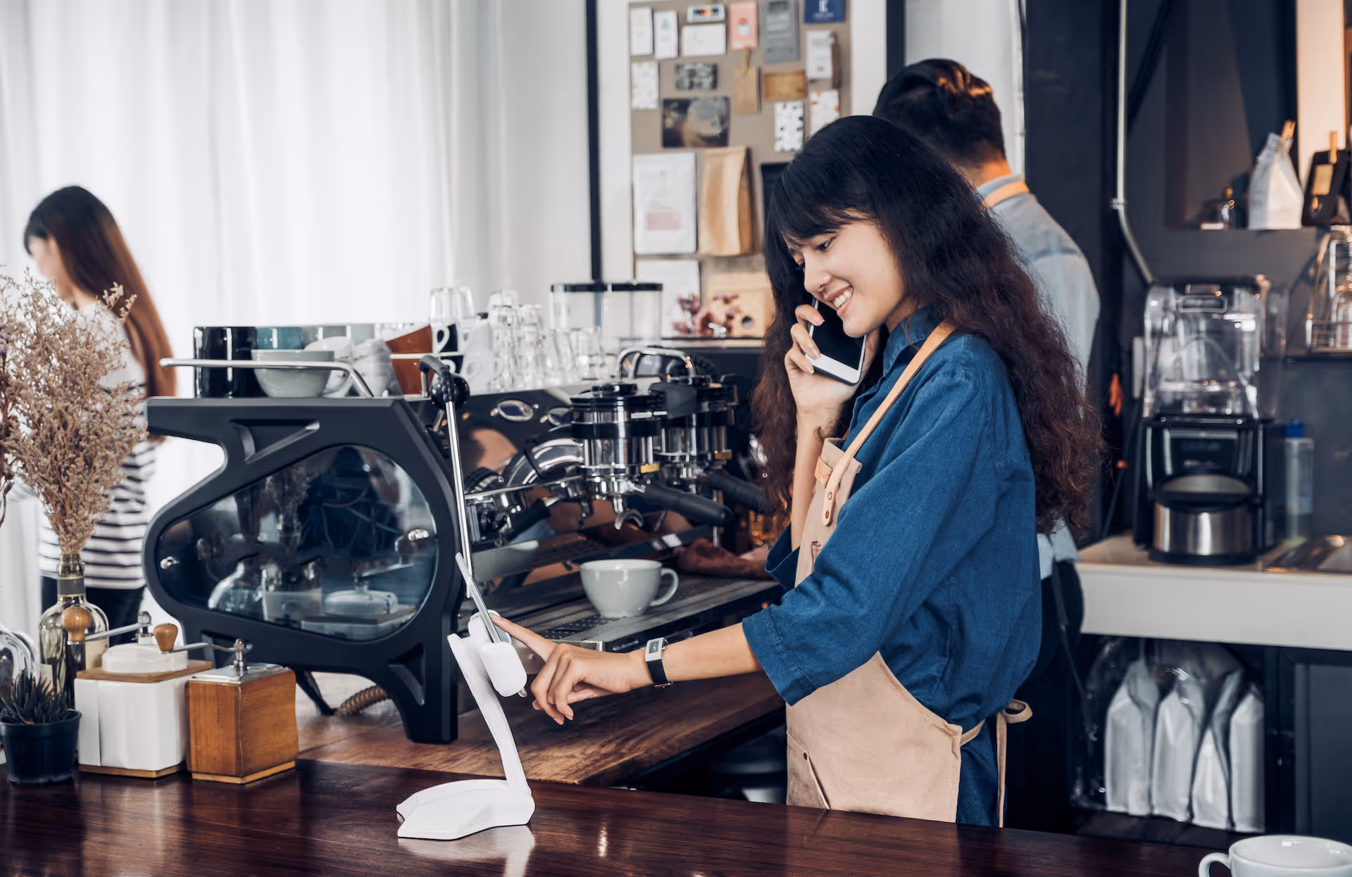 Barista use tablet take order from customer in coffee shop
