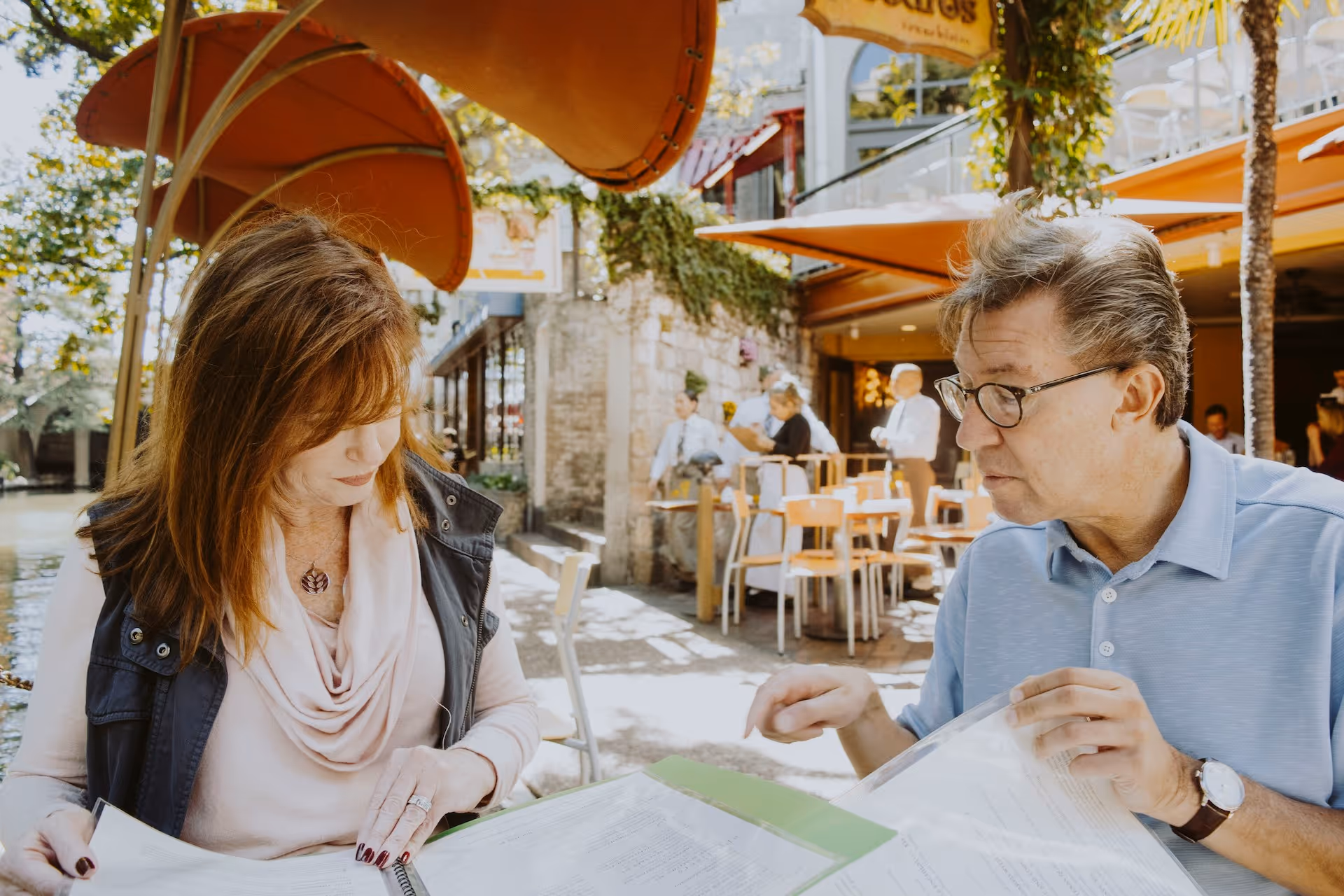 Two restaurant owners look over documents