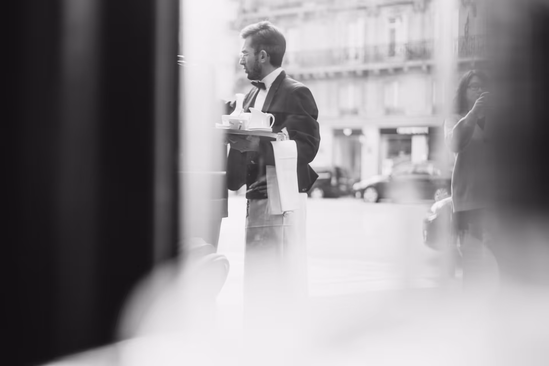Waiter seen through a restaurant window