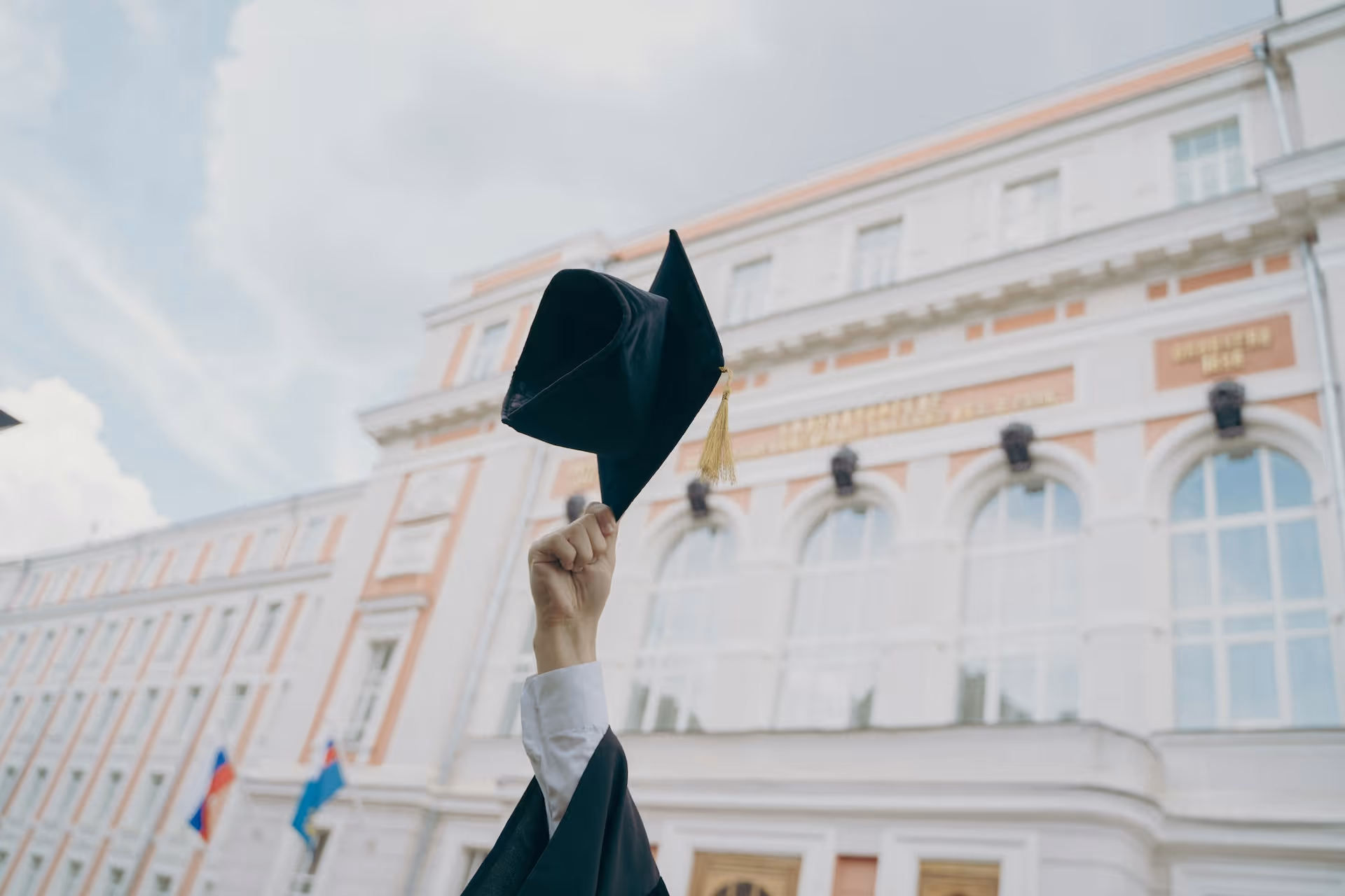 Graduation hat being thrown into the air