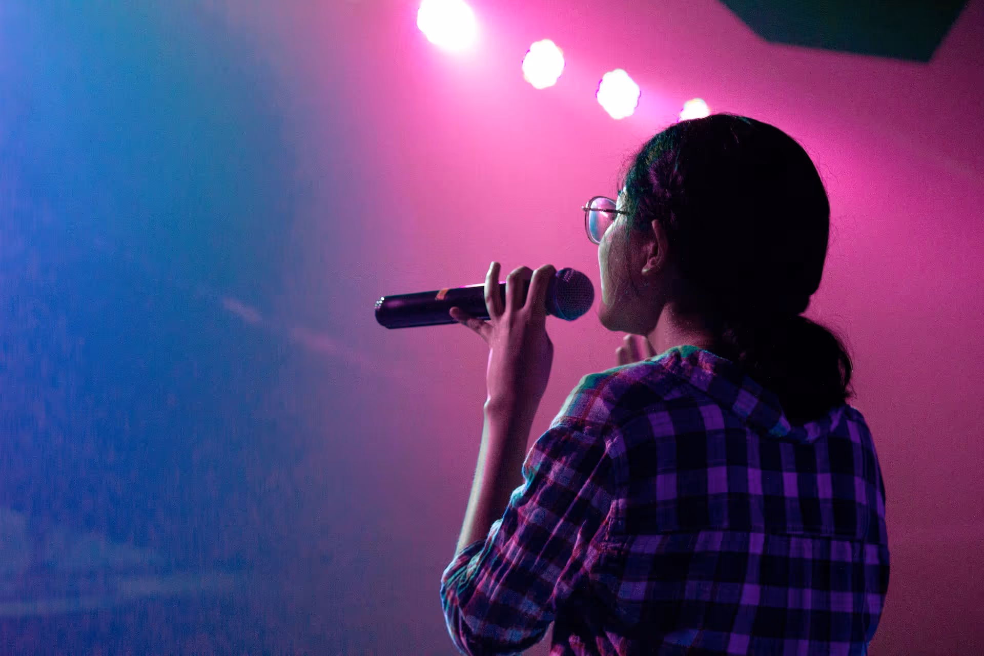woman holding microphone