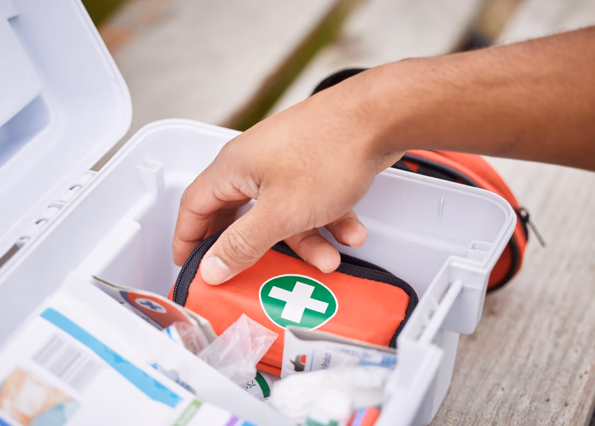 Paramedic looking in his first aid kit
