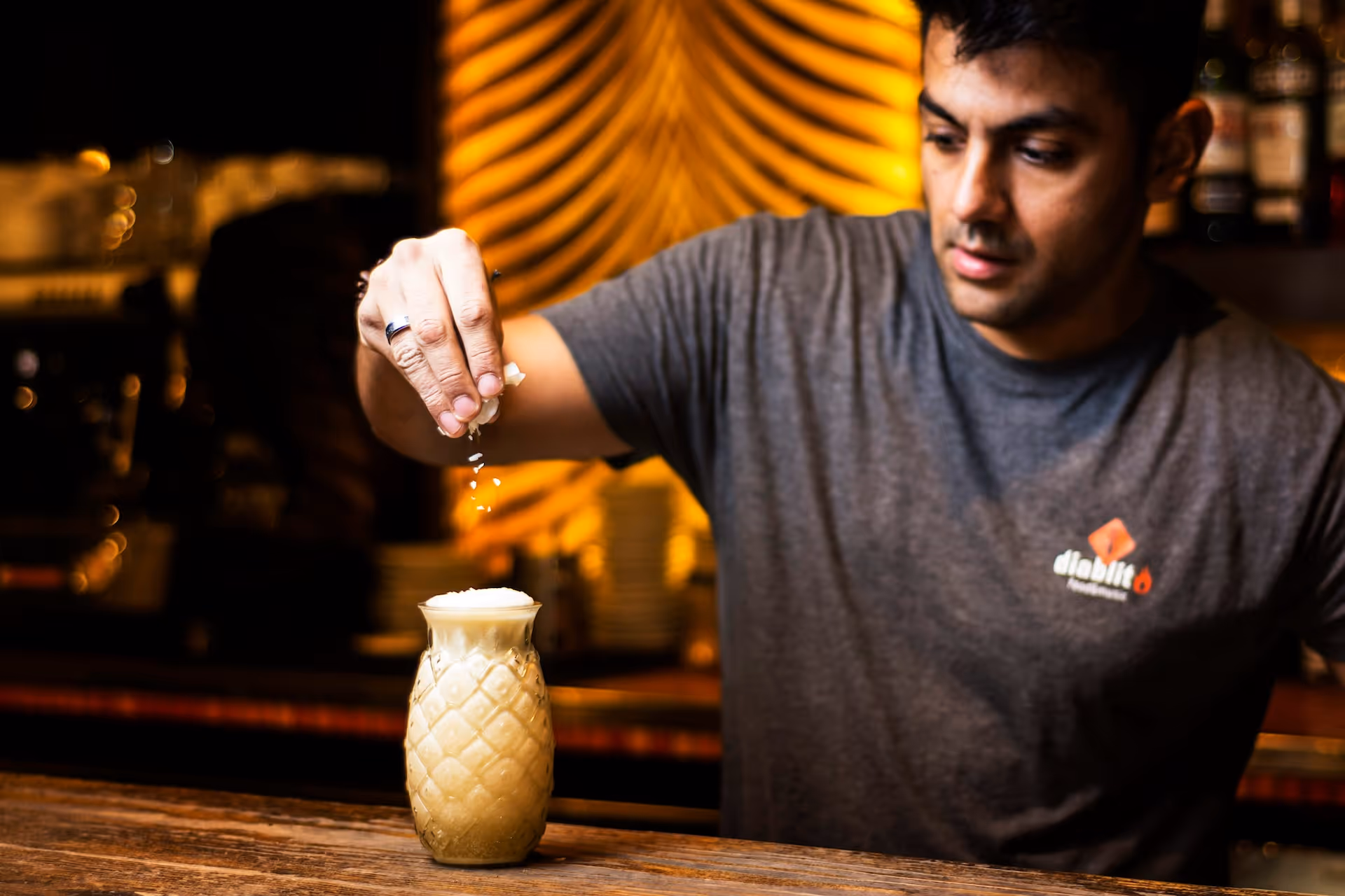 bartender preparing pina colada bar drink