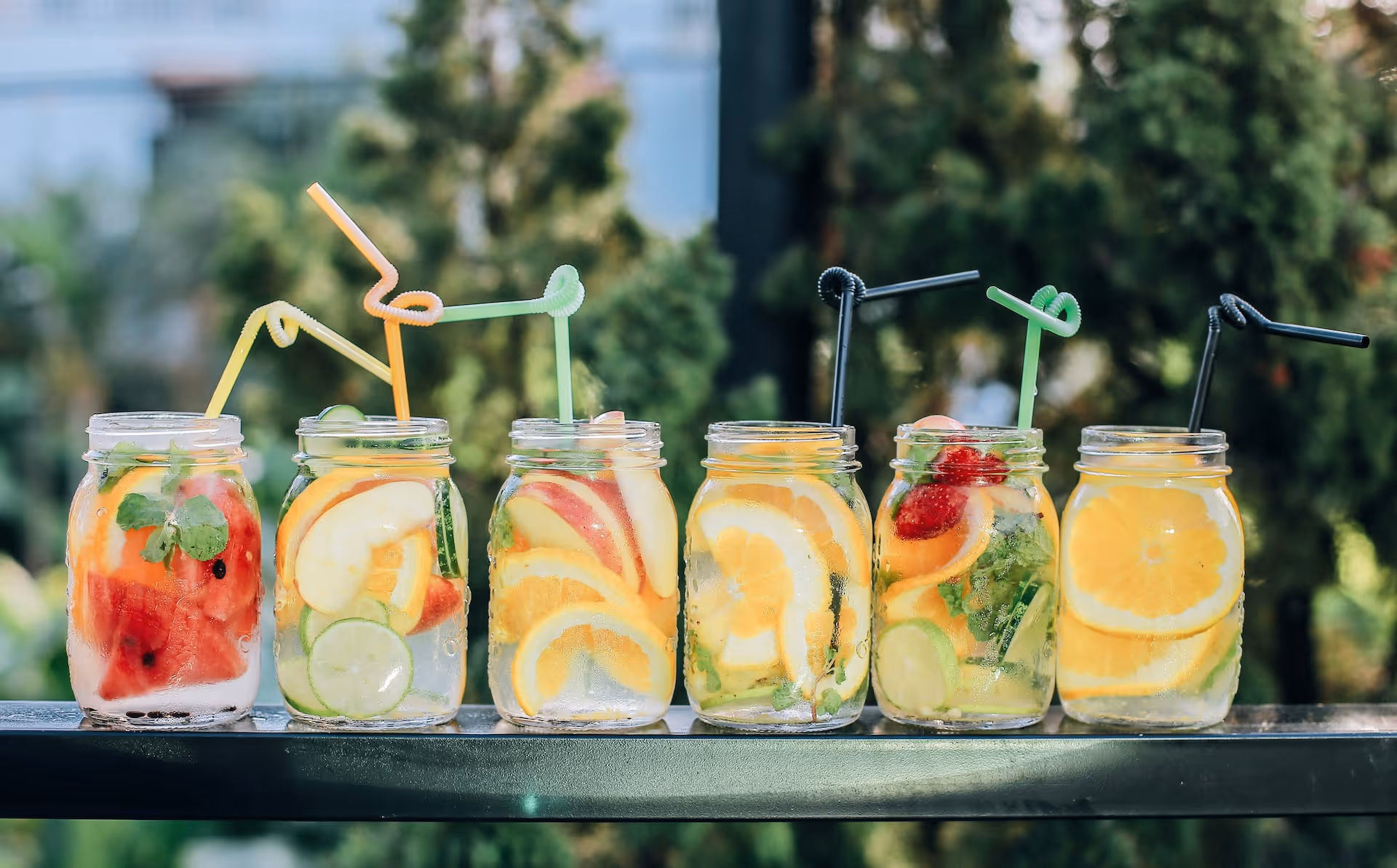 mason jars filled seasonal fruit and bar drinks