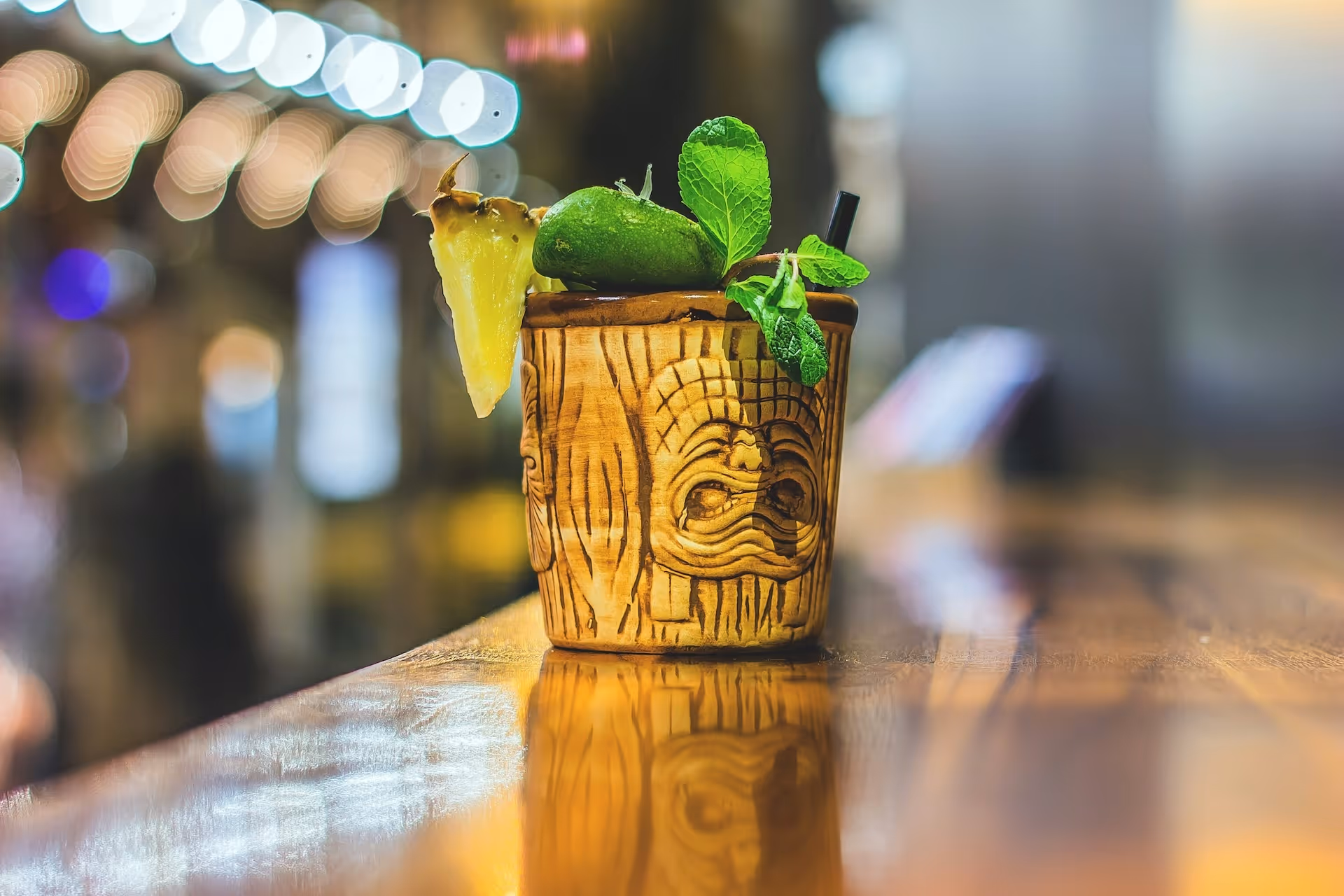 mai tai bar drink with mint and pineapple slice