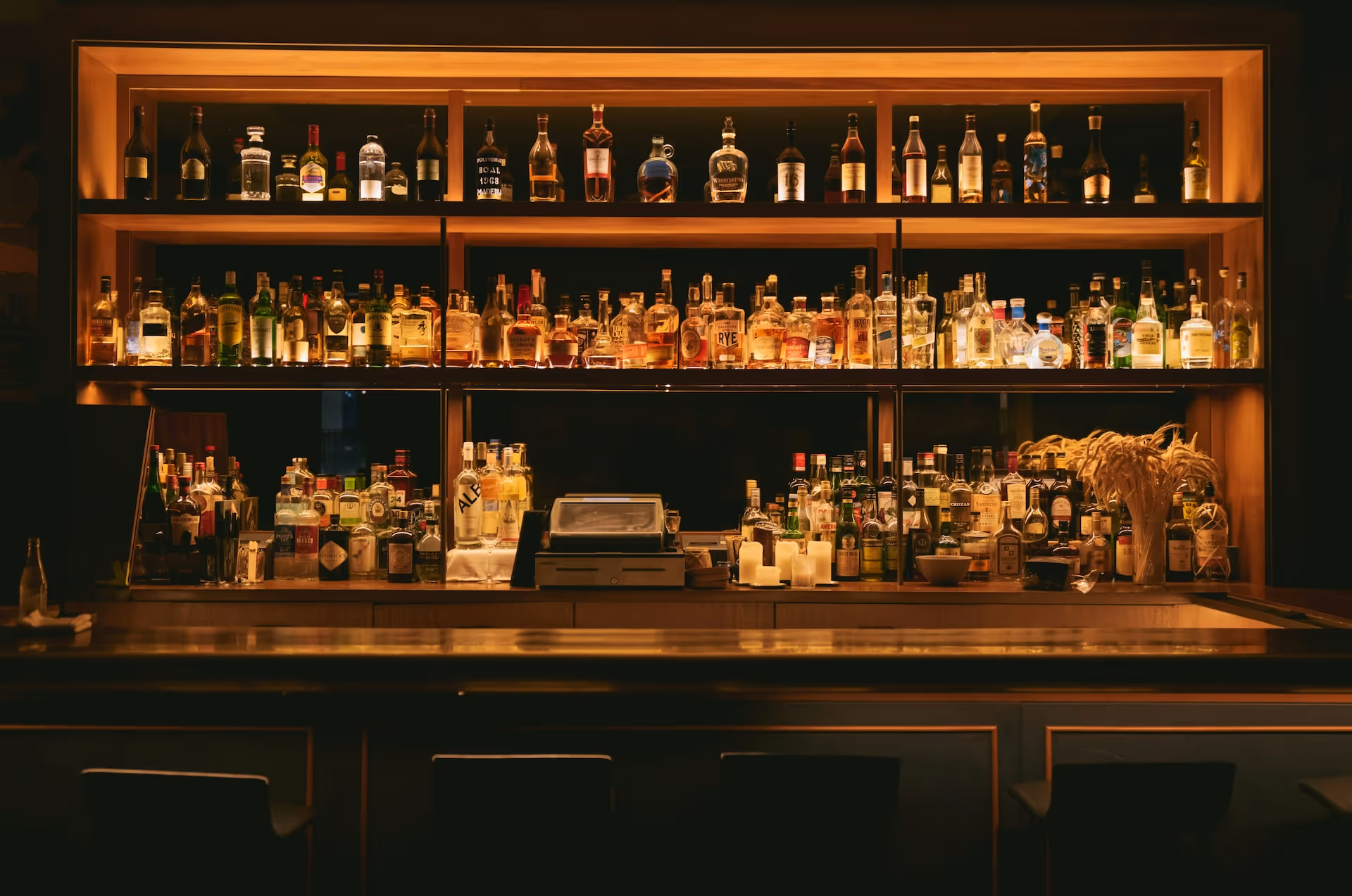 brown wooden shelf with bar drinks