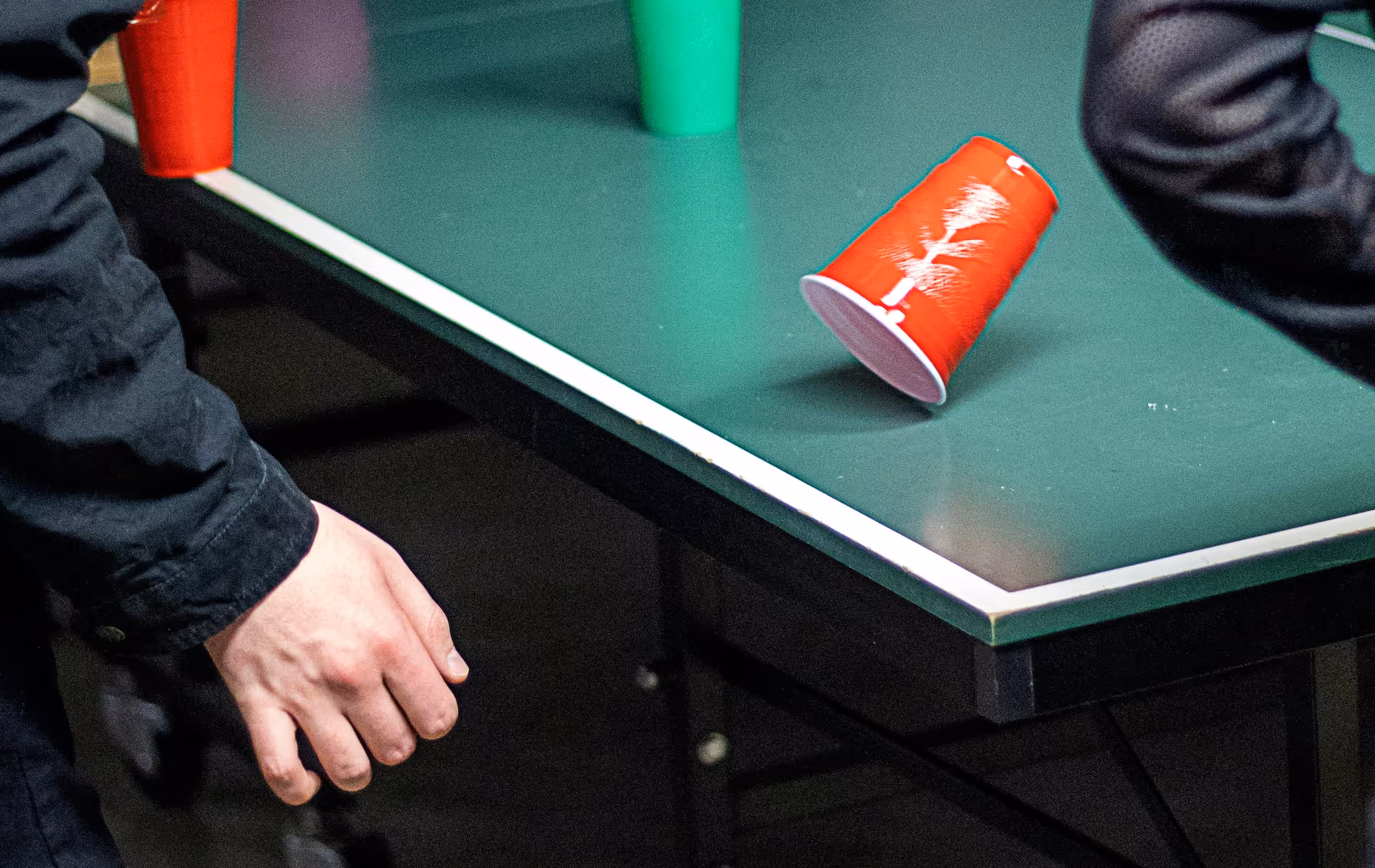 man playing flip cup drinking game