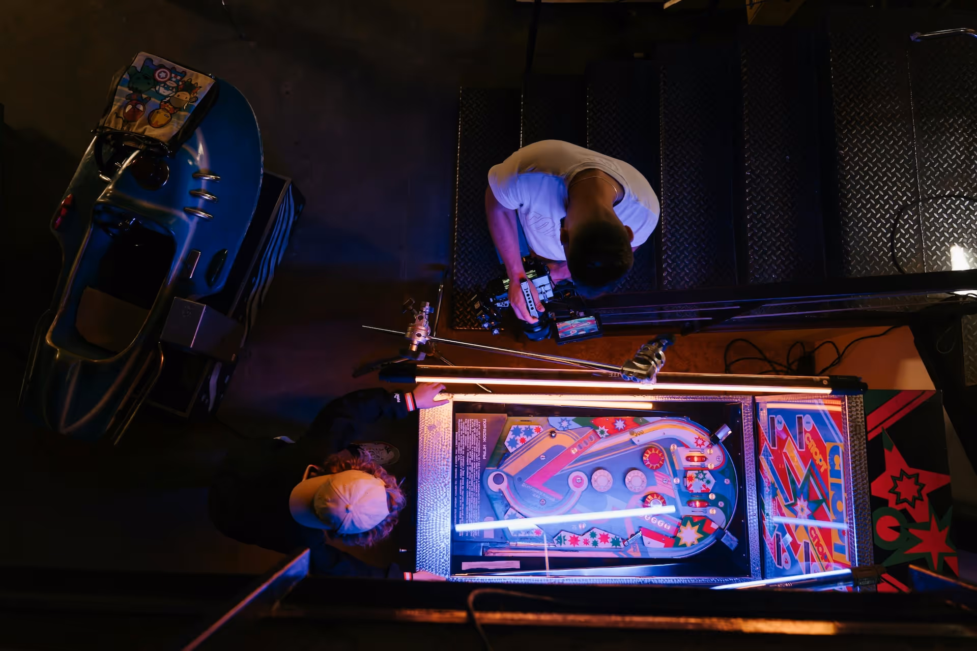 man playing pinball bar game