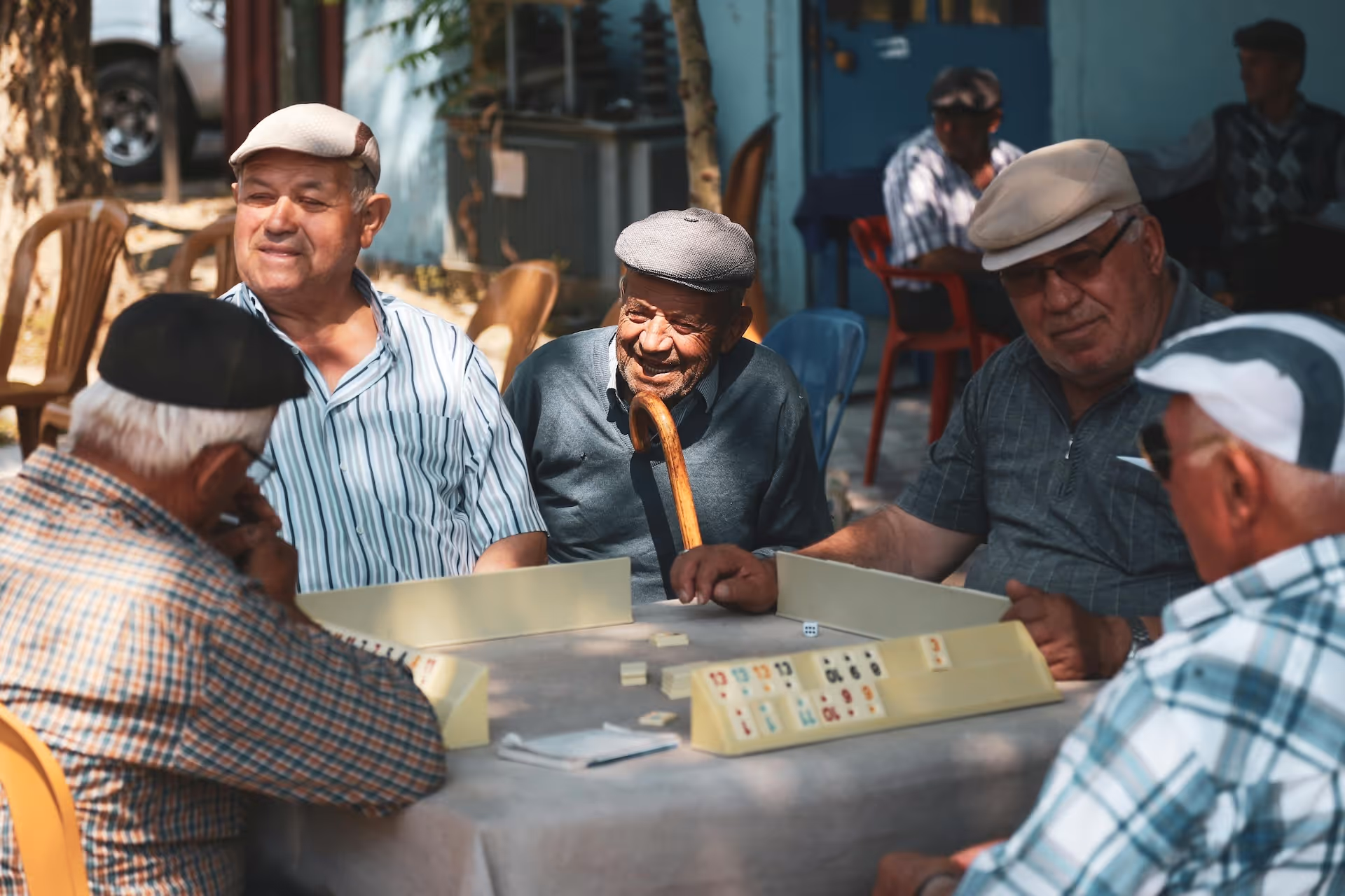 group of old men playing bar games