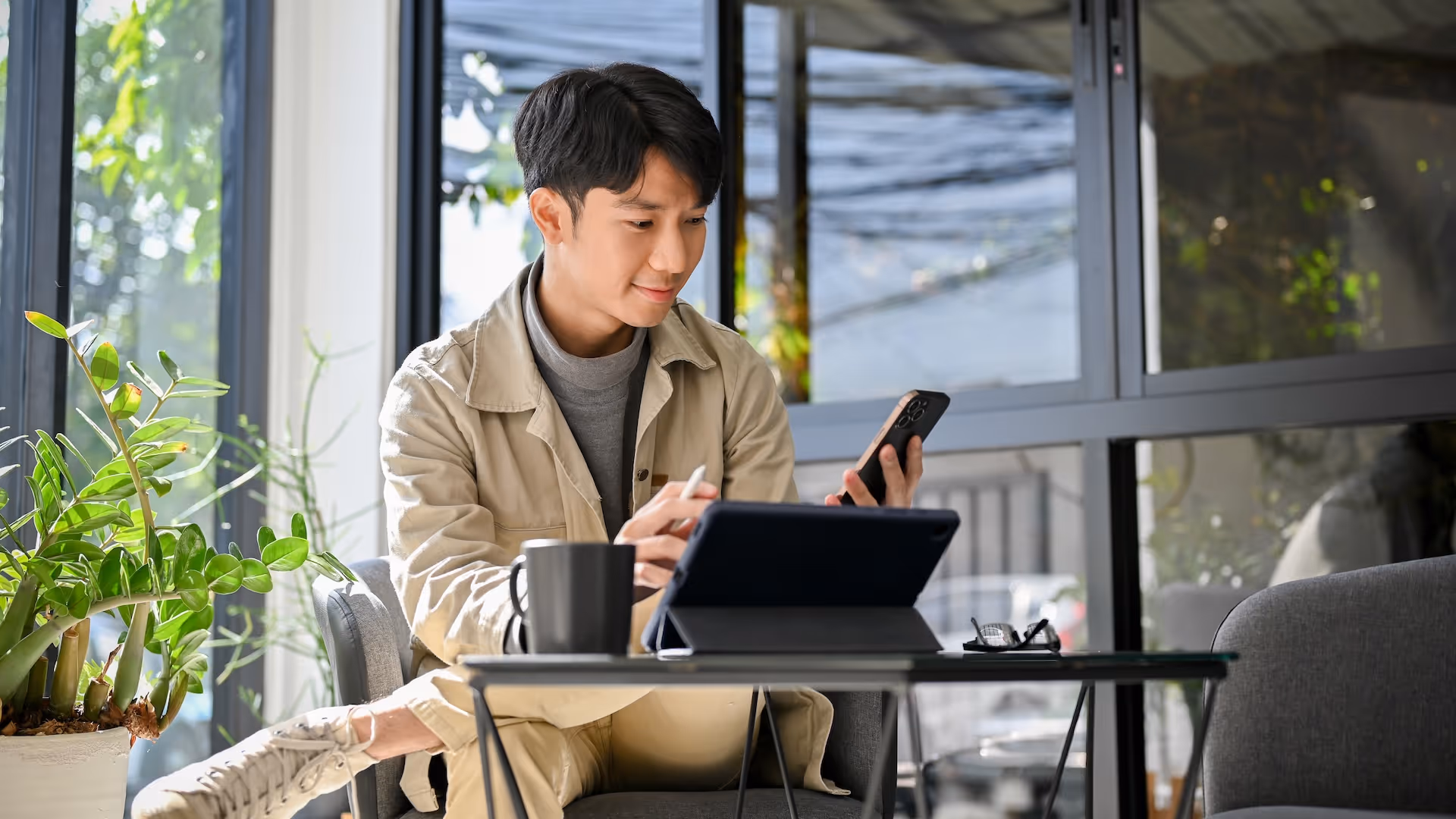 man using event management services at a coffee shop