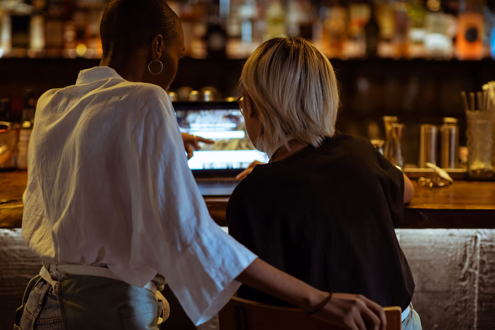 bar staff working together on menu
