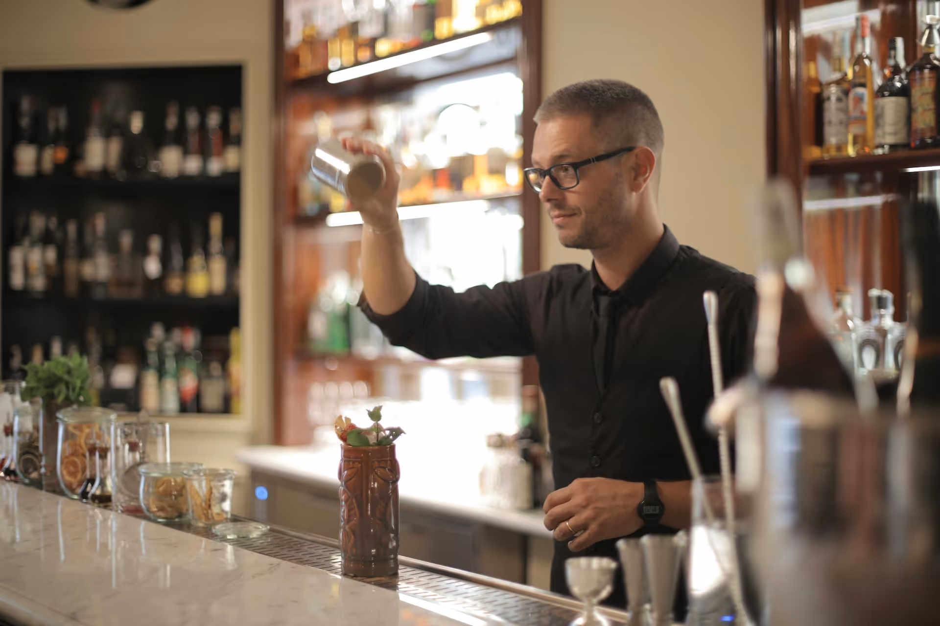 bartender making signature cocktail