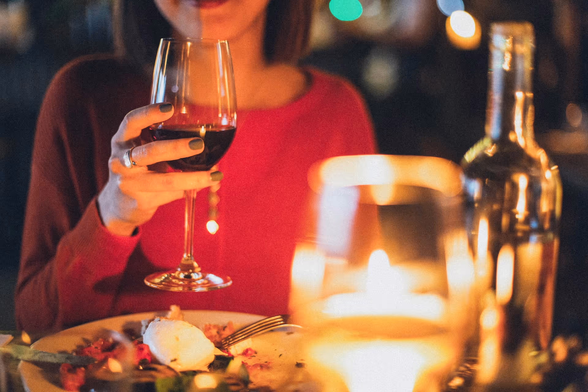 woman holding wine glass