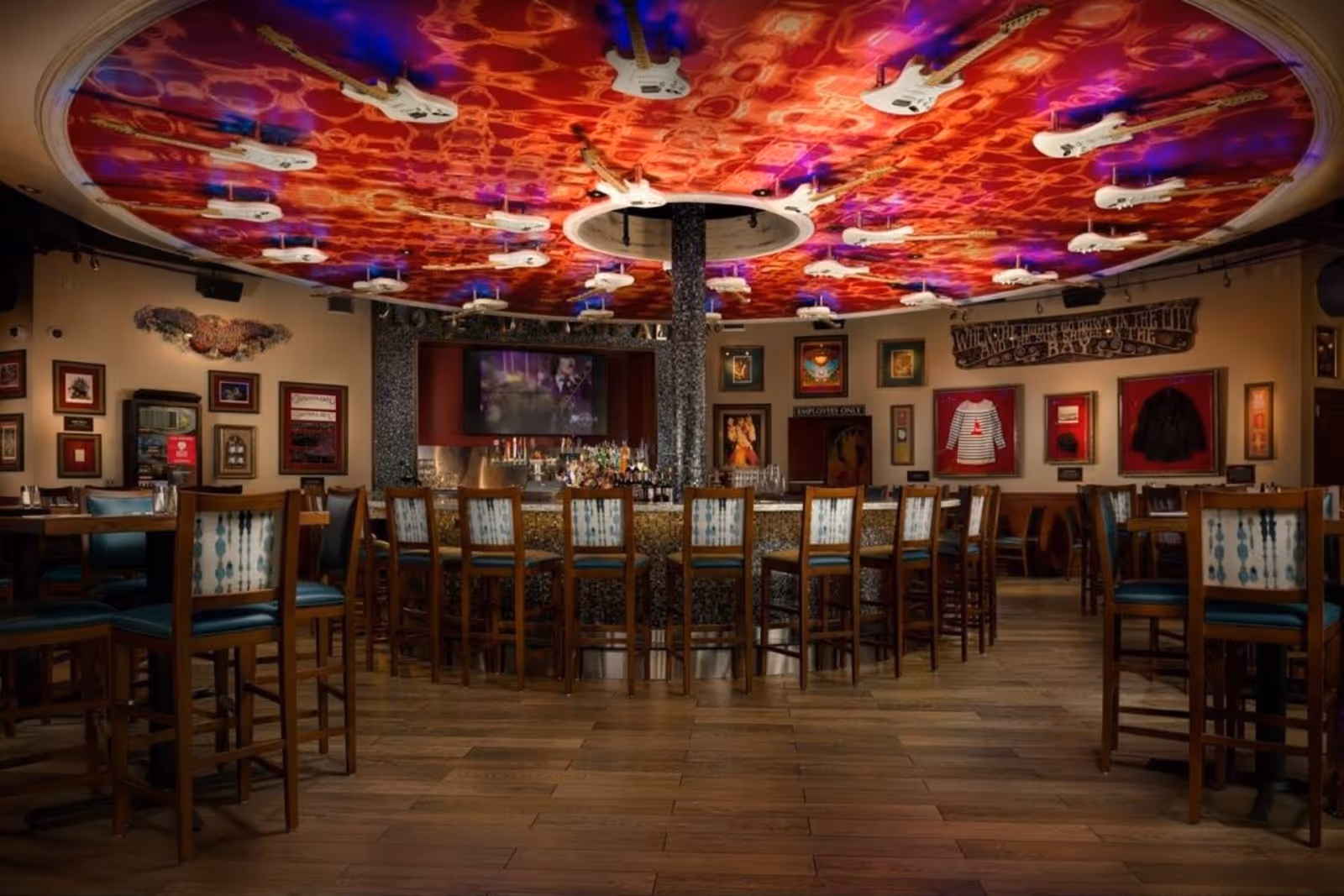 bottom-to-top view of Hard Rock Cafe interior, with a view of the electric guitar display on the ceiling, North Beach SF