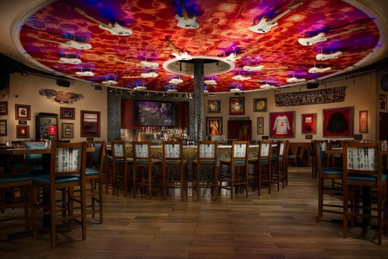 bottom-to-top view of Hard Rock Cafe interior, with a view of the electric guitar display on the ceiling, North Beach SF