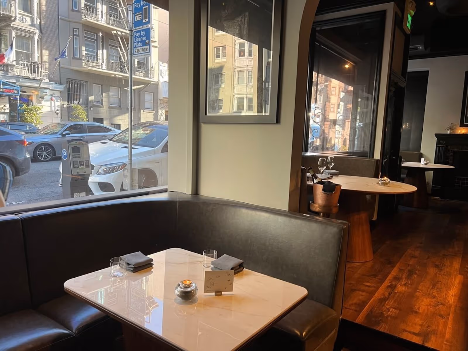 interior view of Sons & Daughters restaurant, San Francisco, with a view out into the street