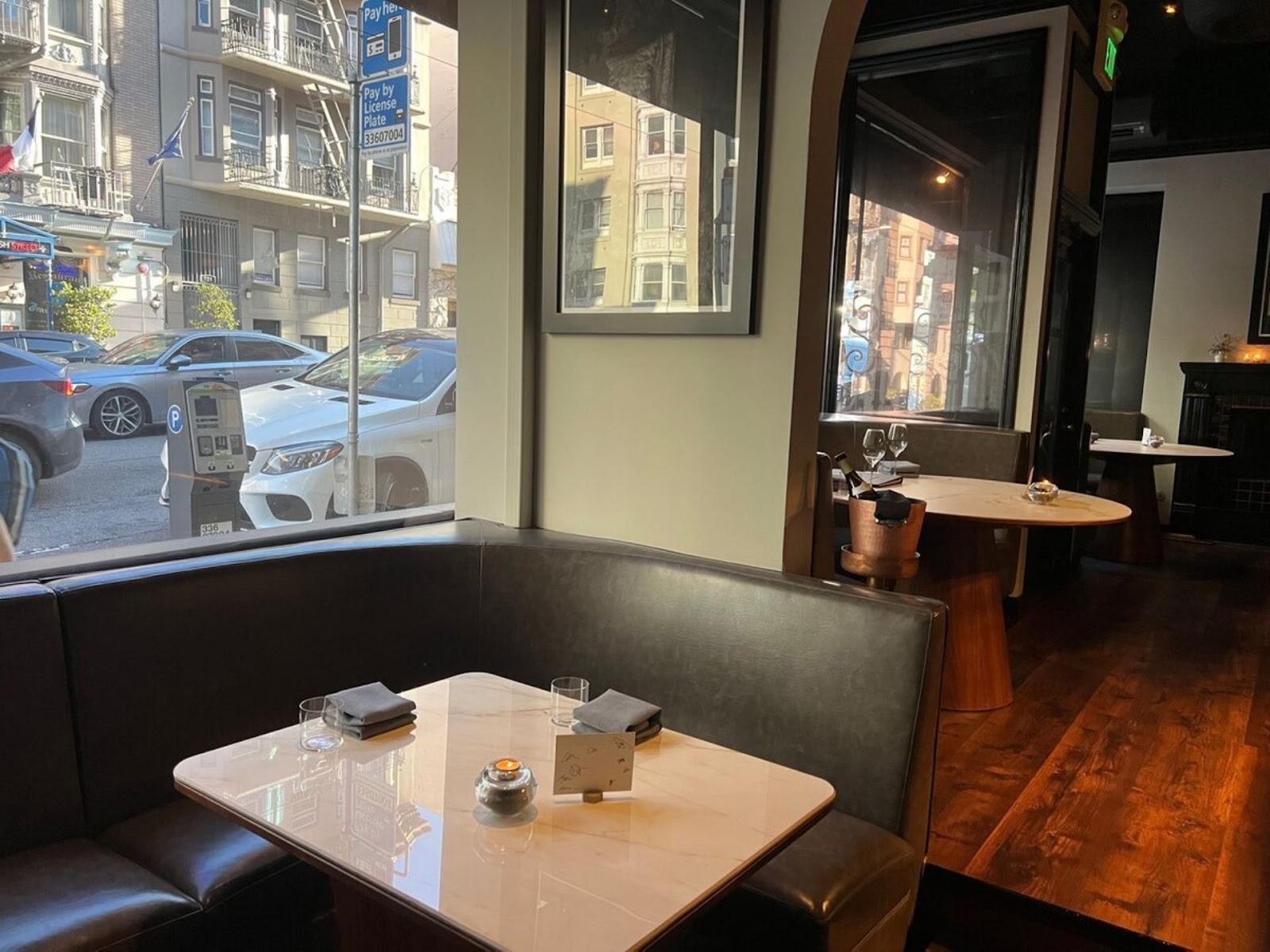 interior view of Sons & Daughters restaurant, San Francisco, with a view out into the street