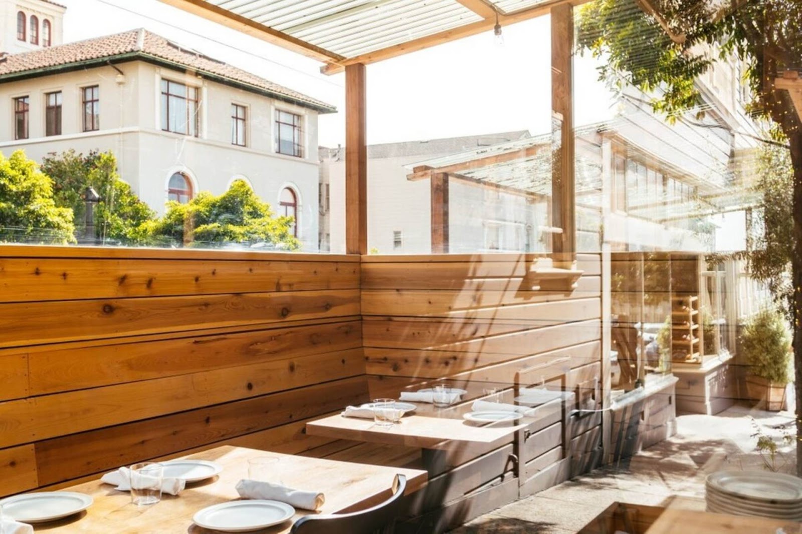 sunlight pouring into Octavia restaurant in San Francisco, with a view out to the street