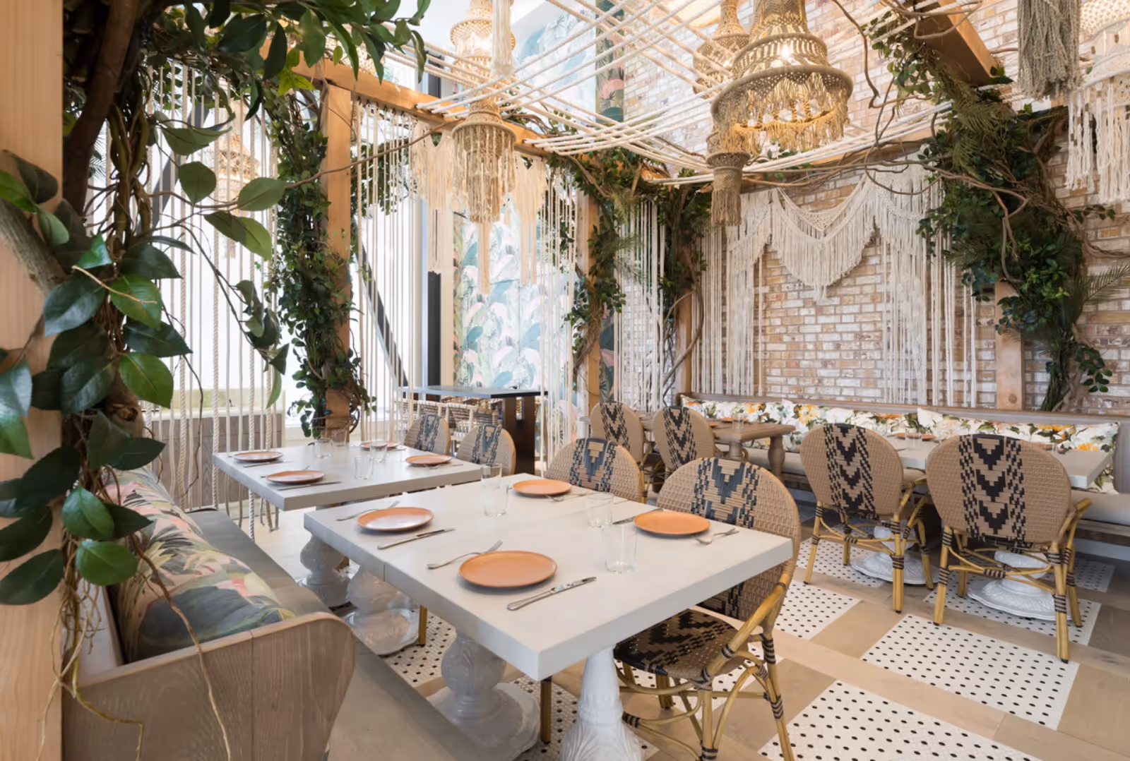 interior view of seating and chandeliers at Copra restaurant, SF