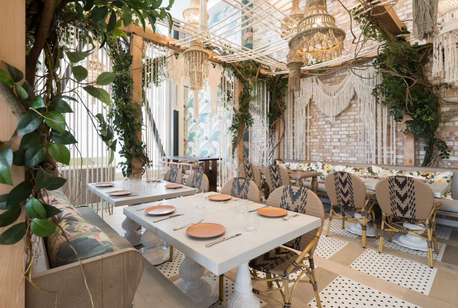 interior view of seating and chandeliers at Copra restaurant, SF