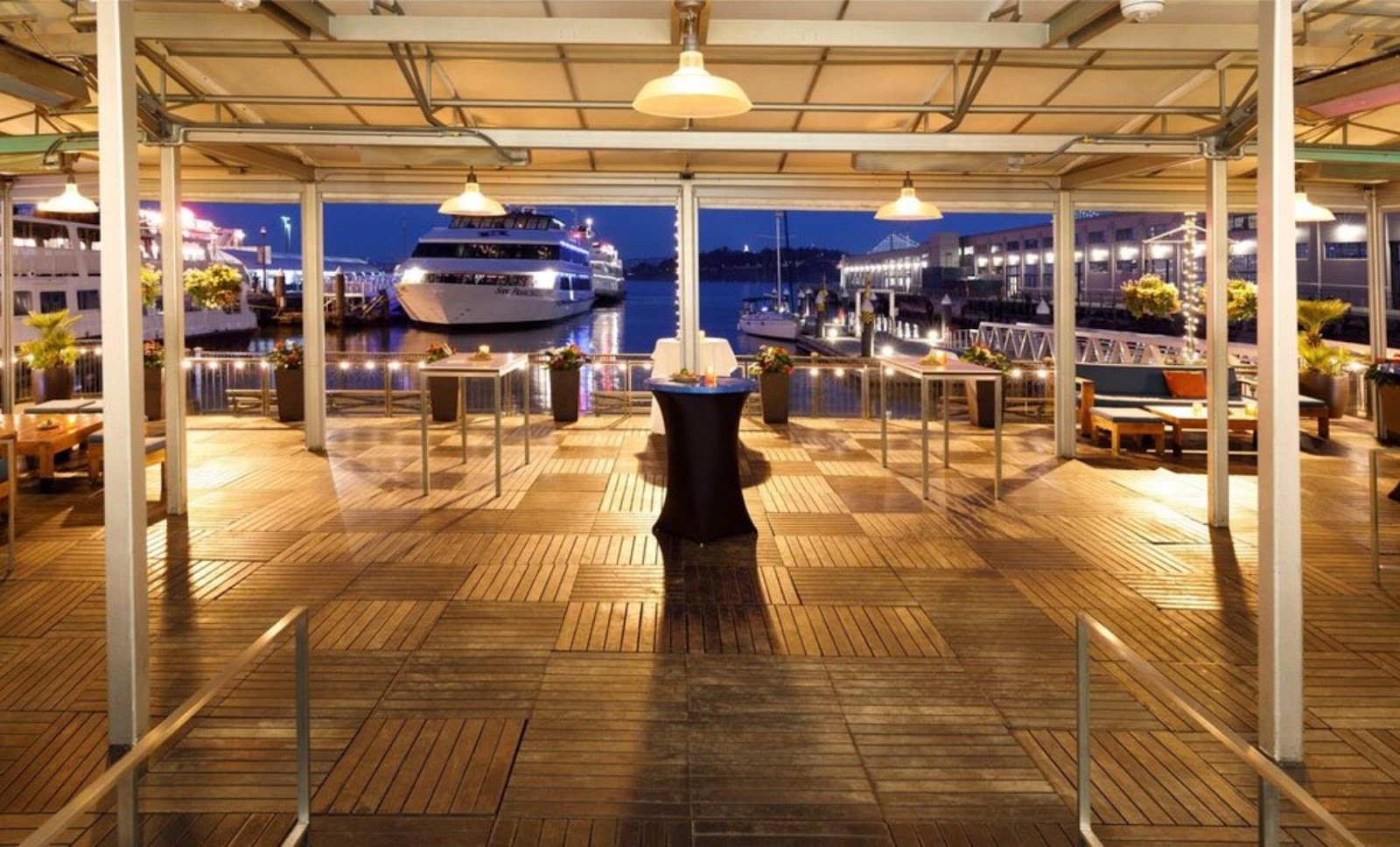 interior view of La Mar Cocina Peruana and superyacht in San Francisco harbor