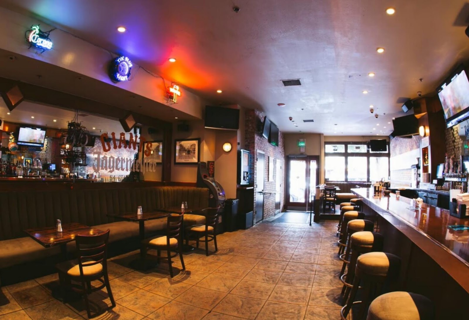 a long dining booth and bar at The Blue Light, Pacific Heights