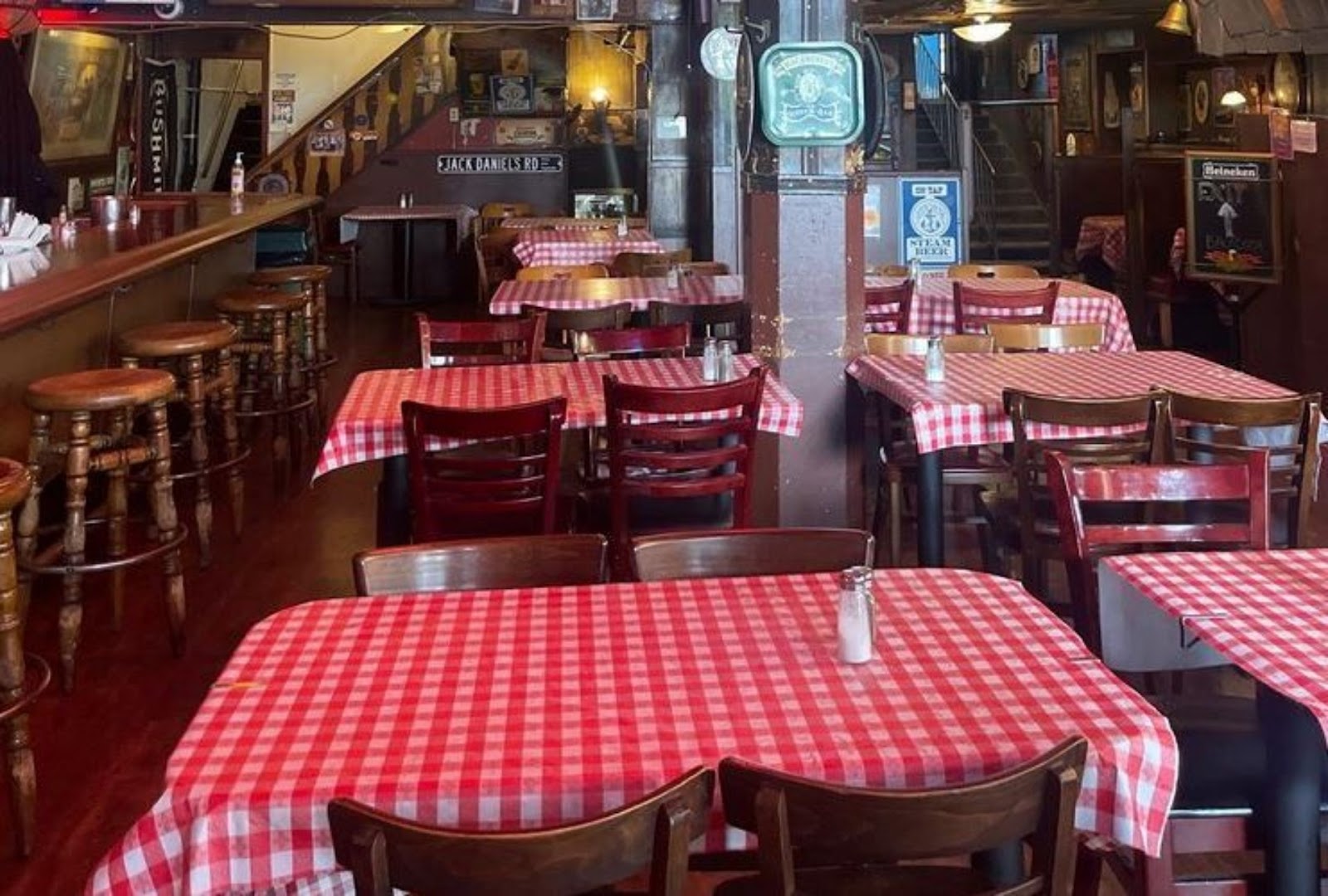 interior view of picnic-style dining tables and bar at Tommy's Joynt restaurant, SF