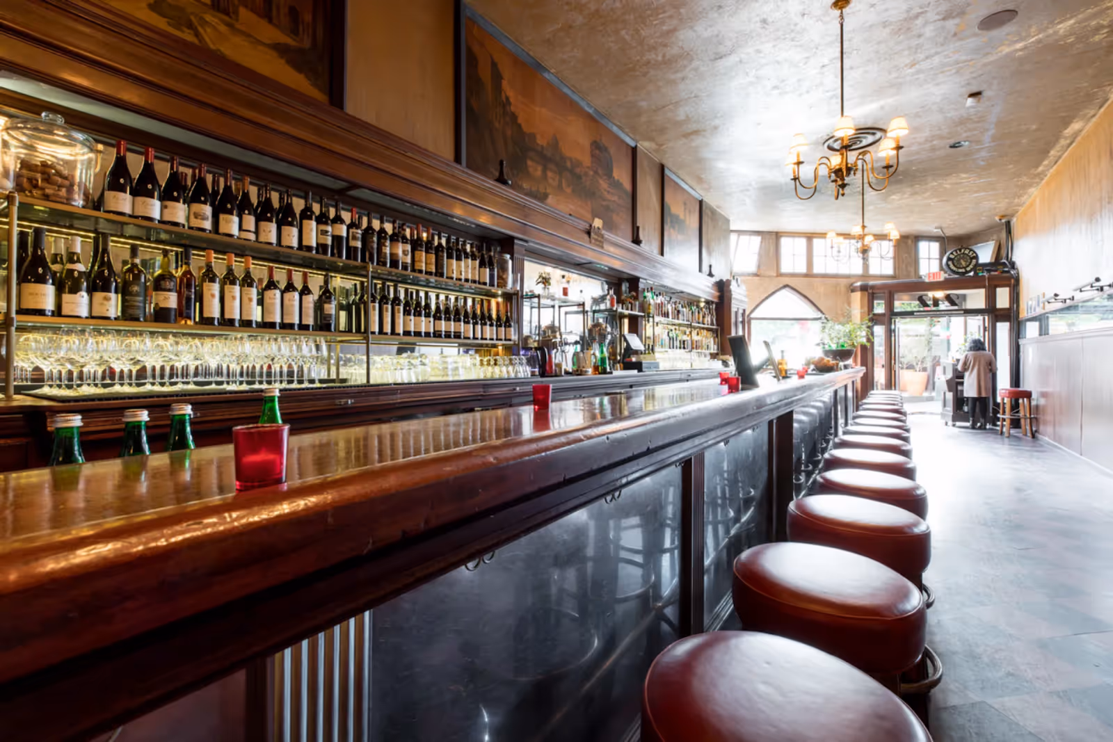 interior of Tosca Cafe with the fully-stocked bar in the foreground