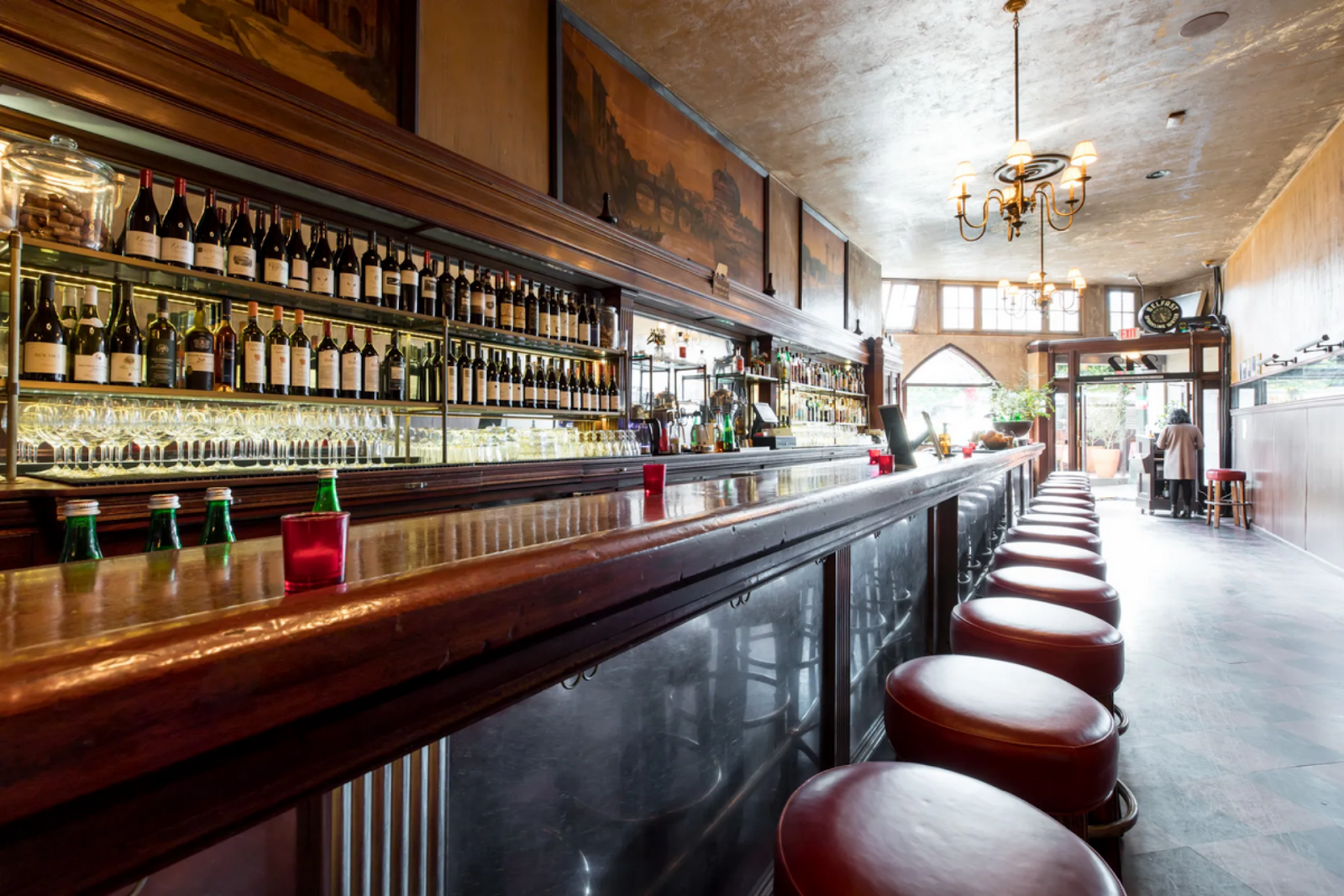 interior of Tosca Cafe with the fully-stocked bar in the foreground