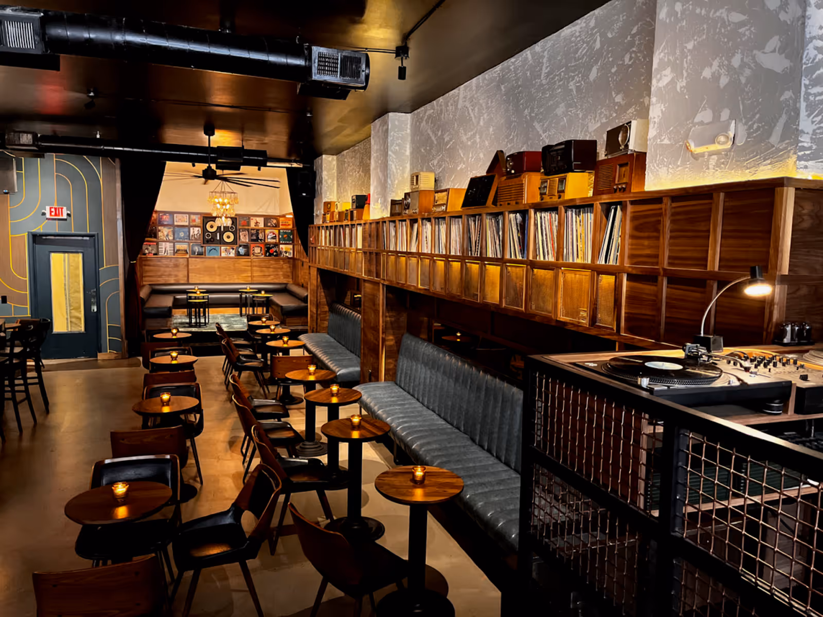 booth seating next to high shelved stocked with vinyl records at Harlan Records, Union Square SF